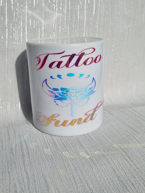 ceramic money box with tattoo fund motive