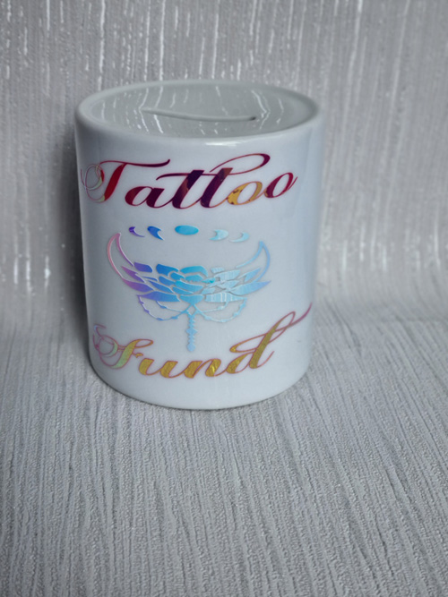 ceramic money box with tattoo fund motive