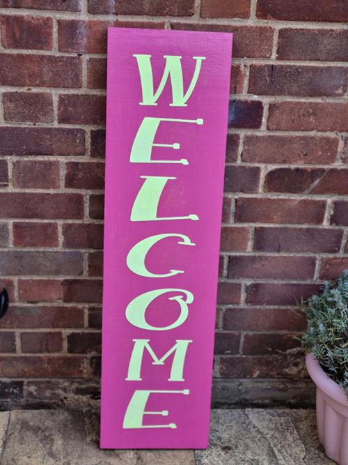 Reversible house sign with welcome text