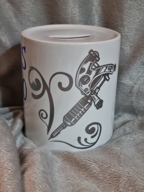 ceramic money box with simon's tattoo fund motive
